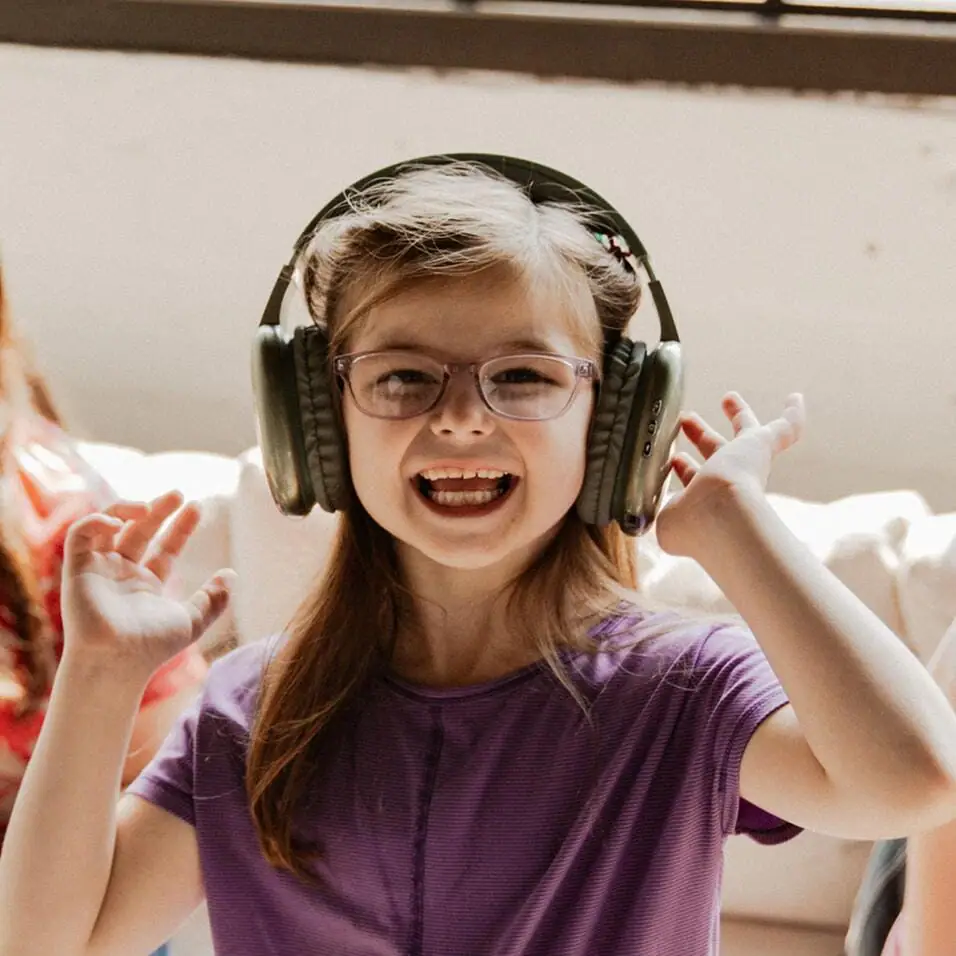 Elementary student wearing a black headset