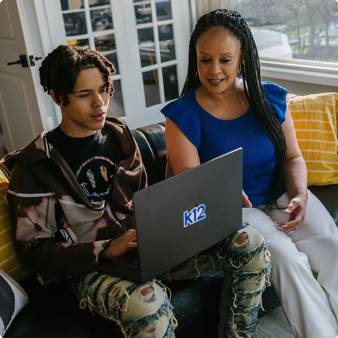Mother and her child with their laptop