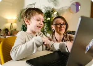 Mother and her child working with their laptop