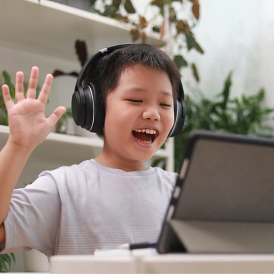 Student wearing a black pair of headphones