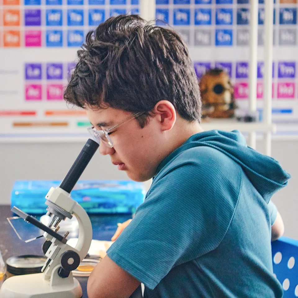 Student with a microscope