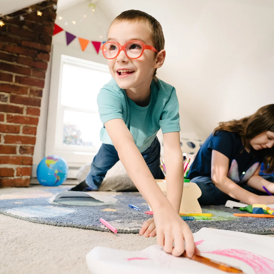 Elementary student painting at his home